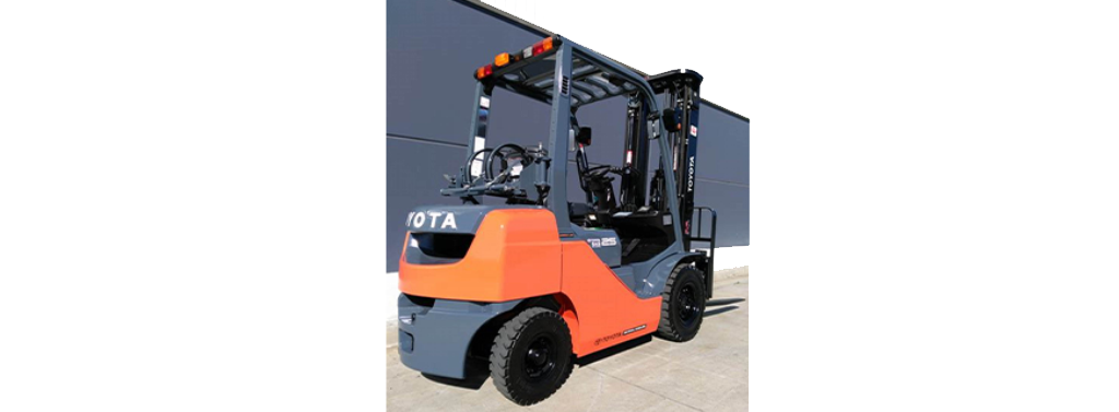 Forklift moving beverage pallets in bonded warehouse